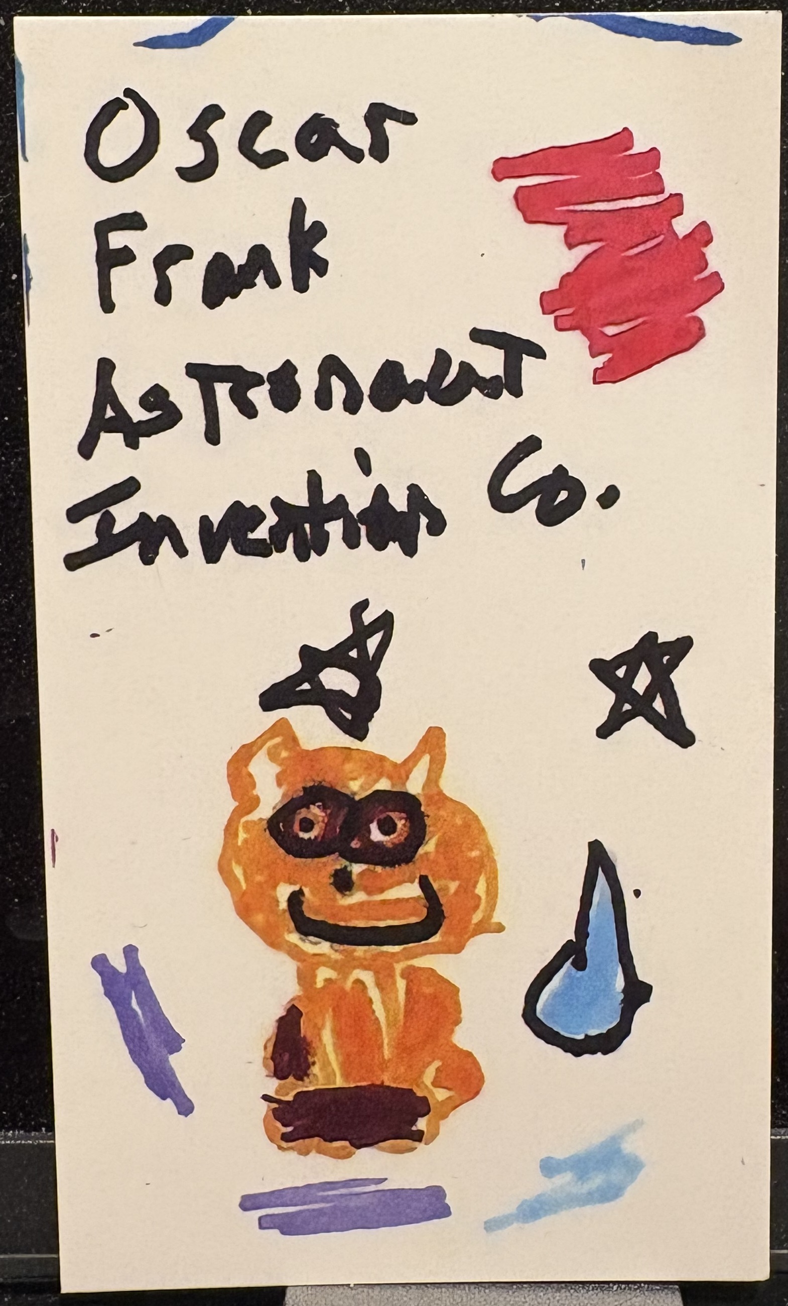 Hand-drawn Oscar Frank Astronaut Invention Co. business card featuring an orange cat mascot